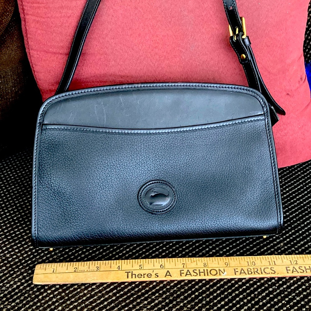 Authentic Dooney & Bourke  shoulder bag with straps long enough to cross body.